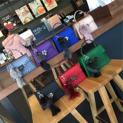 China 2021 Rivet Design Women GENUINE LEATHER Luxury Purses Honed PVC Jelly Sandy Matte Handbags for sale