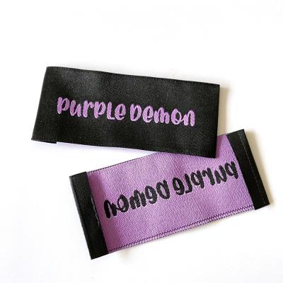 China Washable Custom Brand Polyester Clothing Accessories Tagger Labels Black Woven Labels For Garment for sale