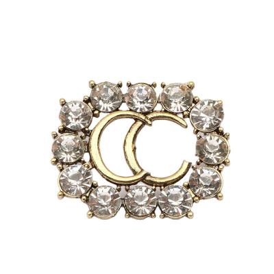 China 2021 New Brand Diamond G Logo Alloy Brooch Jewelry Baroque Pearl Christmas Jewelry Dinner Accessories Injection Molding Accessories for sale