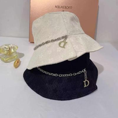 China D letter chain fisherman hat lady travel sunshade fresh soft trend hat European barred and American hat D letter chain for sale