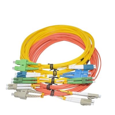 China FTTx Ftth Ribbon Braid Optical Patch Tie Cable Cord 12 Fan Mpo Fiber Optic Patchcord For Gpon for sale