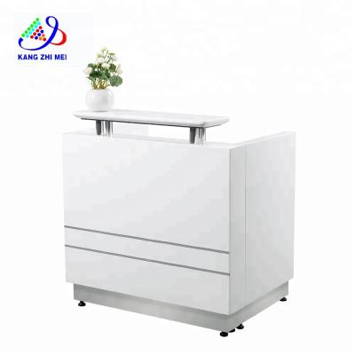 China Kanmgei Modern Furniture Small Front Reception Desk Counter Table High Glossy White Wood Convertible Cheap Price Beauty Salon Furniture for sale