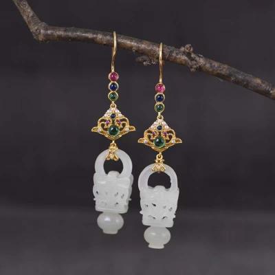 China Long color keeping the newest trend of 2020 design S925 silver gold plated micro-inlaid creative cavity carving Hetian jade earrings for sale