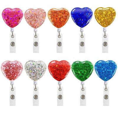 China New Arrivals ID Card Badge Holder Plastic Glitter Epoxy Glitter Heart Shaped Retractable Rotate Badge Holder for sale