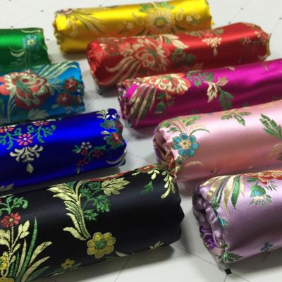 China Dobby brocade figured dacron or Chinese Qipao dress material bags, crafts, retro paisley brocade fabric for sale