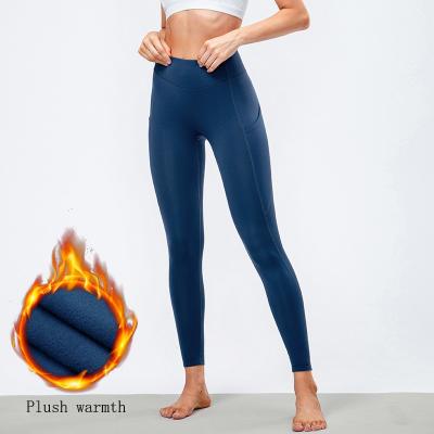 China Breathable Ladies Autumn And Winter Fleece Warm High Waist Yoga Leggings Tight Fitness With Pockets for sale