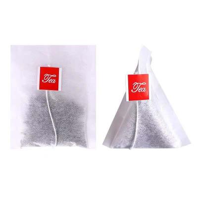 China Hot Sale Disposable Tea Bag Filter Paper Pyramid Biodegradable Empty Tea Bags With String For Tea Packaging for sale