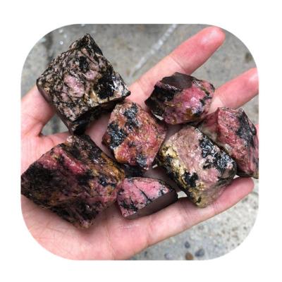 China Europe Crystals healing raw gemstone natural pink black rhodonite rough stones for Wholesale for sale