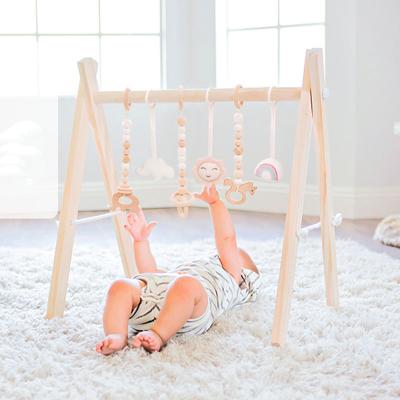 China Eco-friendly.anti-slip.water-proof XIHA Montessori wooden baby gym play set with rattle hanging toys kids play foldable gym toy set hanging frame for sale