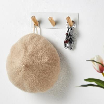 China Universal Hallway Minimalist Punch-free Nail-free Magnetic Head Hanging Hook Beech Iron Wooden Rack for sale