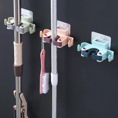 China Minimalist JX- Wall Mounted Broom Broom Fixed Clips Household Broom Umbrella Holder Bathroom Wall Hanging Nailless Broom Clip With Hooks for sale