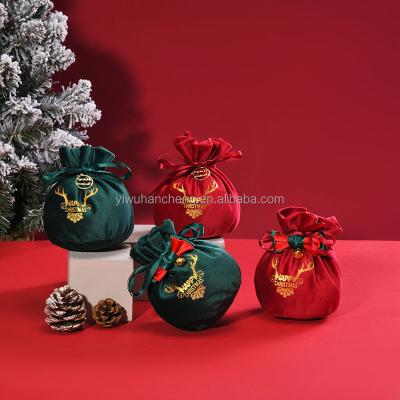 China Luxury Cute Merry Christmas Eve Gift Candy Velvet Storage Bowknot Flannel Drawstring Pouch Eco-Friendly New Year Decoration for sale