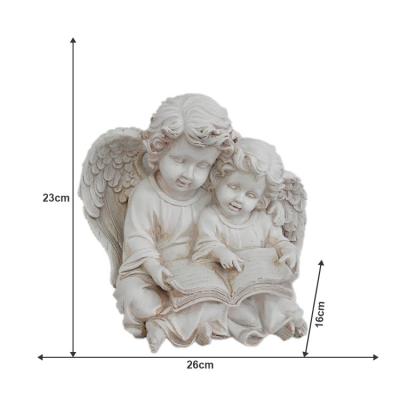 China JiXin OEM ODM Global White Baby Read Book Angel Sculpture Figurine Statue For Other Outdoor Garden Lawn Bedroom Home Decor Resin Crafts for sale