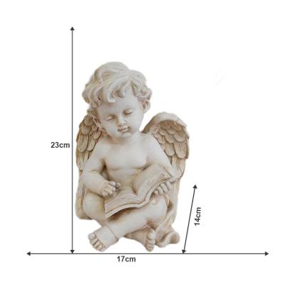 China Small World Angel Statue Art Ornament ODM Polyresin JiXin Resin Deco Read Book Angel Outdoor Garden Lawn Decoration Figurines for sale