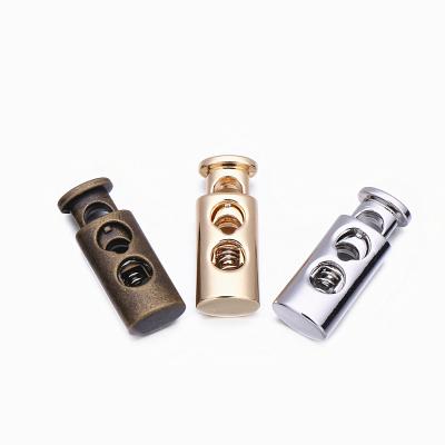 China New Style Double Hole Cylinder Spring Rope Lock Cord End Nickel Free Rope Toggle Stopper for sale