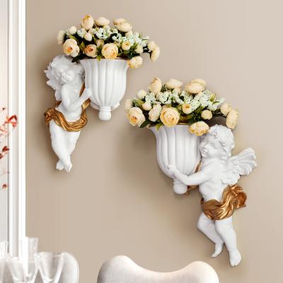 China Retro Minimalist Creative Living Room Potted Flower Planter Wall Hanging Cupid Wall Vase Background Wall Decor Flower Vase For Home Decor for sale