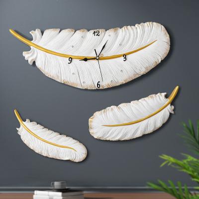 China Nordic home decor wall sticker clock quartz battery wall clock office and school wall clock resin feather non-ticking silent driving watch for sale