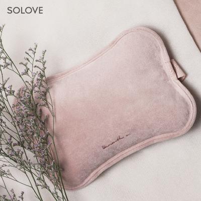 China R6 Safety And High Quality Custom Rechargeable Hot Water Bottle Electric Hot Water Bag Cute With Hand Pocket For Women Baby Use Te koop