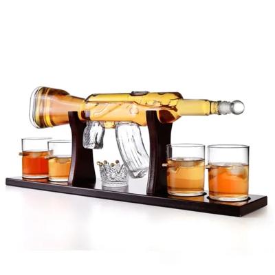 China Hot Sale 750ml Liquor Gun Shaped Glass Liquor Art Bottle For Packing Wine/Vodka/Whiskey/Spirits/Beverage With Stop for sale