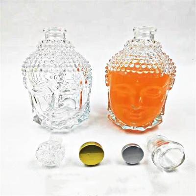 China Beverage Buddha Head Shape Glass Wine Spirit Alcohol Bottles 750ml Buddha Glass Super Clear Bottle for sale