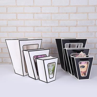 China Recyclable Transparent Trapezoidal Net Red Window Bouquet New Window Wrapping Paper Flower Hand Held Bag for sale