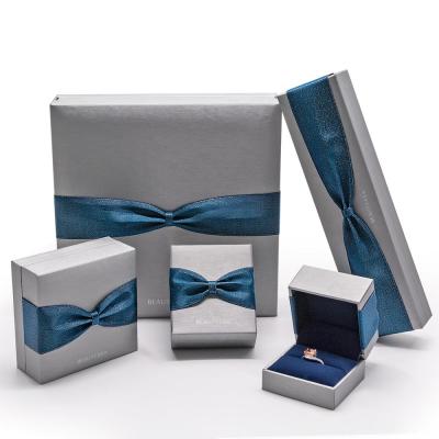 China custom color & Wholesale Cheap Logo Jewelry Paper Box Packaging Cheap Wholesale Boxes Silver Brushed Surface With Ribbon Ring Necklace Bracelet Gift Box Silk Jewelry Packaging for sale