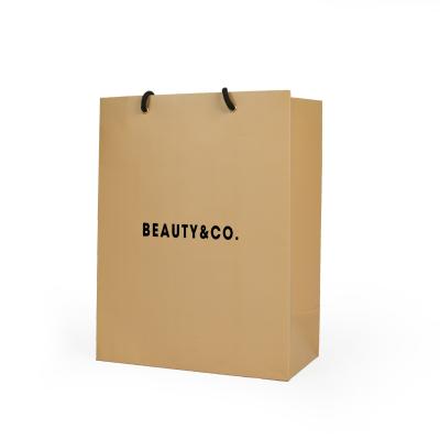 China Craft Gift Recyclable Custom Reusable Luxury Kraft Paper Packaging Shopping Bags With Logo for sale