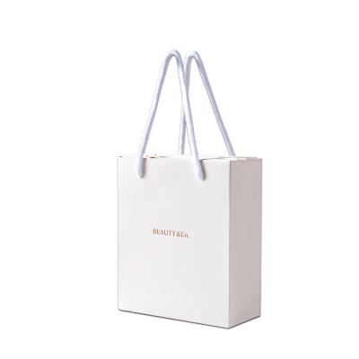 China Wholesale Recyclable Printed Paper Bag Reusable Luxury Custom Shopping Bags With Logo for sale