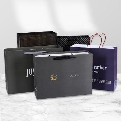 China Recyclable Luxury Ribbon Handle Boutique Shopping Packaging Customized Printed Euro Paper Gift Bags With Logo for sale