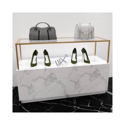 China LUX Design Factory Custom Ladies clothes show design garment store with gold display rack for shoe and bag. 5 years quality guarantee for sale