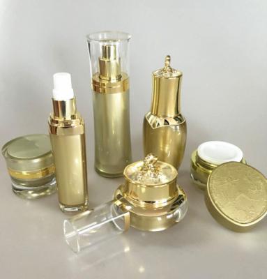 China 100ml Gold Luxury Cosmetics Packaging PMMA Bottle Sets Empty For Skincare for sale