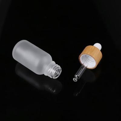 China Cosmetic Packaging​ 50ml Frosted Glass Bamboo Dropper Bottle for sale