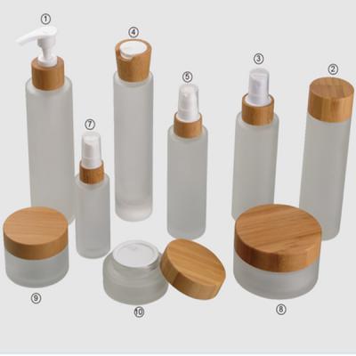 China Frosted Bamboo Cosmetic Glass Jars Sets 15g 30g 150g 50ml 100ml 120ml for sale