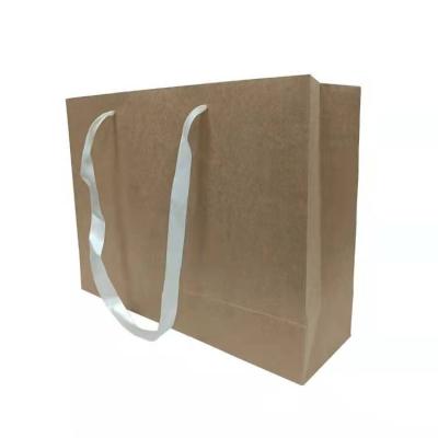 China Recyclable Recyclable Packaging Ribbon Handle Shopping Silk Paper Bags With Logo Printed for sale