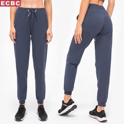 China Lulu Lemon Design Fitness Joggers Women New Outdoor Yoga Sports Breathable Running Tie Waist Ninth Pants With Pockets for sale