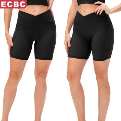 China New Women's Breathable Yoga Shorts Cross Waist Tight Fitness Pants Pockets High Waist Hips Running Sports Shorts for sale