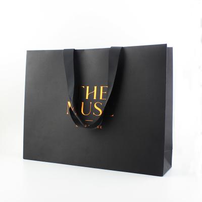 China Security Wholesale Custom Black Paper Shopping Bags With Hot Stamp Logo for sale