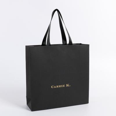 China Luxury and fashion black paper shopping bag barrier for sale