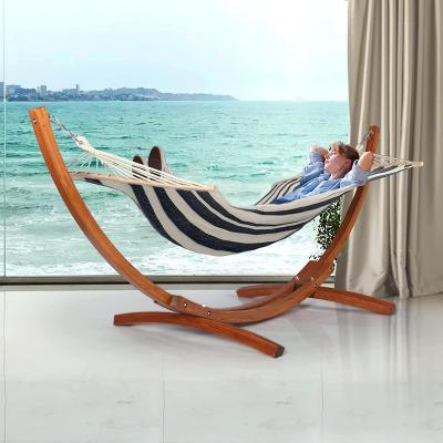 China Modern 10 ft curved wooden hammock stand with portable hammock for indoor and outdoor pine hammock arc stand for sale