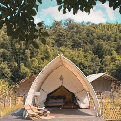 China Outdoor Luxury Large Glamping Hotel Safari Tent Festival Resort Waterproof Camouflage/Field Game Pantrick Tent for sale