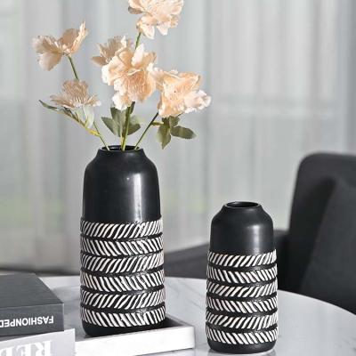 China EAGLEGIFTS Minimalist Item Ceramic Vases Modern Home Handmade Moroccan Round Ceramic Cylinder Vase Quality Matte Black And White Big Long for sale