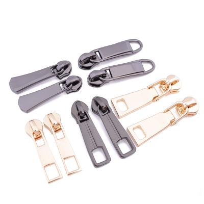 China Reasonable custom zipper puller, garment/luggage/handbag metal zipper puller slider brand logo, main bag zipper puller zipper puller logo for sale