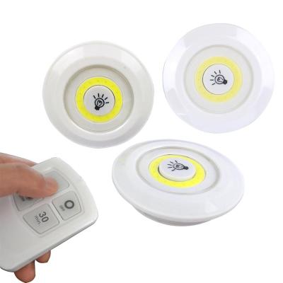 China Mini Shape Smart Light Tap COB LED Stick On Push Light Puck Lights Battery Operated For Cabinets Counters Cabinets for sale