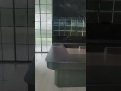 full-wall stainless steel wine cabinet with storage and seating in elegant black
