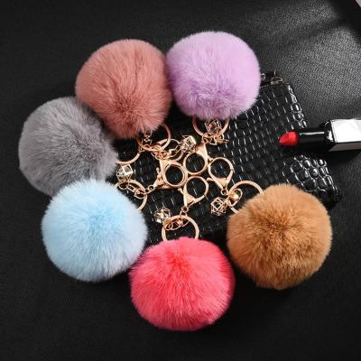 China New Fashion Style Designer Custom Leather Keychain Luxury Fur Pompom Key Chain Accessories Keychain for sale