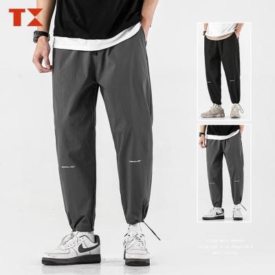 China Streetwear logo anti-pilling men sweatpants track pants track nylon men's jogger sweatpants wholesale custom design white for sale