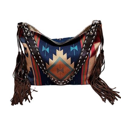 China 2021 Retro Fashion Cotton Shoulder Bag European American Handmade Woven Canvas Cross - Tassel Women Body Bag for sale