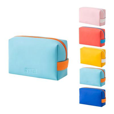 China Travel Waterproof Portable Cosmetic Bag Makeup Bag Candy Color PU Brush Storage Leather Pouch For Women for sale