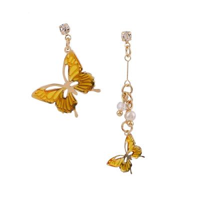 China S925 Needle Amber Bow Asymmetric Drip Oil Non Allergic Zircon Silver Earrings for sale