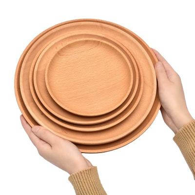 China Sustainable Wooden Round Serving Tray Simple Fashion Fruit Plate Wholesale Circle Tray for sale